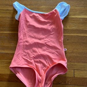 Peach yumiko leotard with white cap sleeves. size extra small